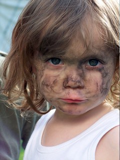 Child With Dirty Coal On Face