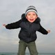 Happy Child By Ocean