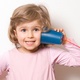Child listening on a toy string phone