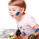 Messy baby playing in paint