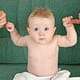 Cute baby holding on to fingers