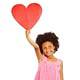 Girl holding up large paper heart
