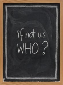 Chalk board with message "If not us WHO?"