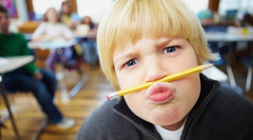 disruptive boy in classroom