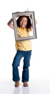 Girl holding picture frame