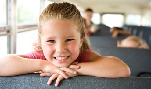 Girl riding on school bus