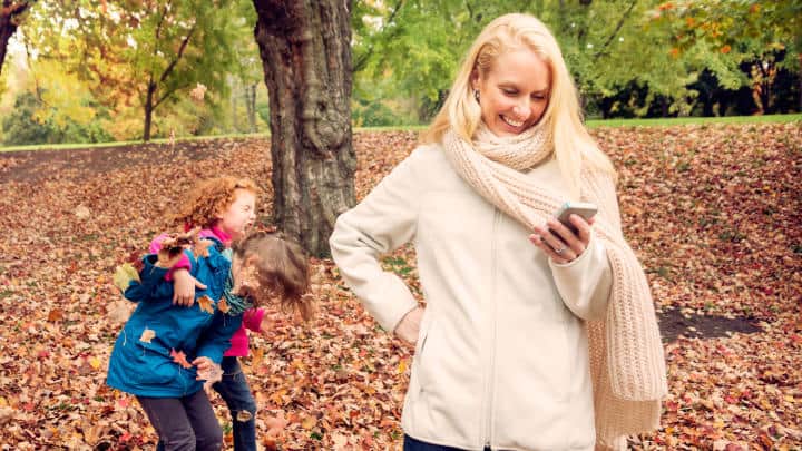 Mom on cell phone missing fun with her kids