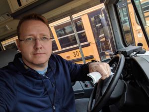 Tony Kummer driving a school bus